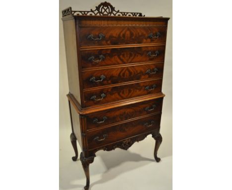 A 5-piece mahogany bedroom suite in Chippendale style,
comprising a serpentine front knee hole dressing table, a serpentine f