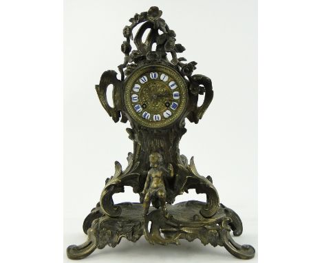 An ornate 19th century bronze mantel clock,
having white and blue enamel numerals and 2-train movement, height 15".