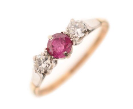 Ruby and diamond three-stone ring, the yellow metal shank stamped '18ct &amp; Pt', size P, 2.2g gross approx