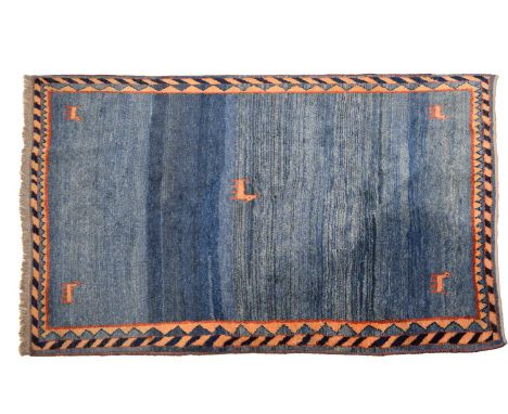Vintage Habitat wool rug in the Gabbeh style, the sea blue ground with animals, enclosed in diagonal and triangular patterned