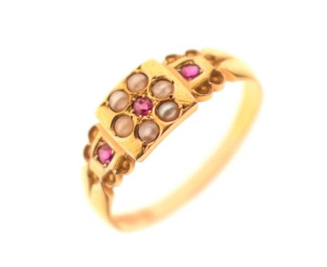 Victorian ruby and split pearl 15ct gold ring, flower motif to the centre and a ruby to each shoulder, Birmingham 1894, size 