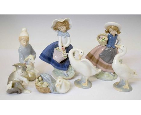 Lladro - Group of seven porcelain figures to include; 'Pretty Pickings' (5222), girl with a basket of flowers, boy with lamb,