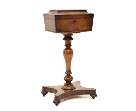 Early Victorian mahogany teapoy, the hinged cover enclosing a caddy fitted interior and glass bowl, baluster column on concac