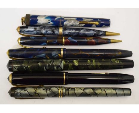 Seven vintage fountain pens / mechanical pencils each with marble effect finish, to include a Conway Stewart Releif No.12, th