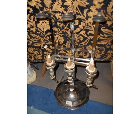A vintage chromium bar optic on stand