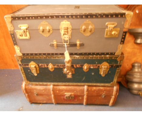Three vintage steamer trunks