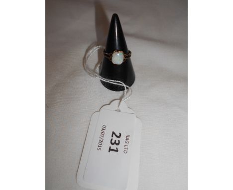 A 9ct gold ring inset with opal, size K
