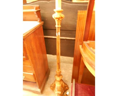 An ornate gilt painted standard lamp with mirrored insets
