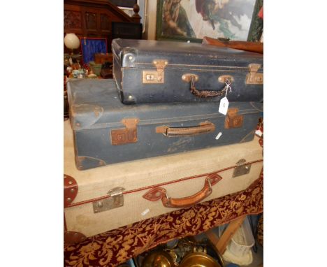 Three vintage suitcases