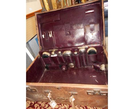 An early Austrian Zum Stock Im Eisen leather vanity case the interior fitted with a bone handled grooming set, bottles, inkwe