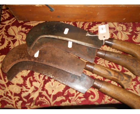 Four vintage bill hooks