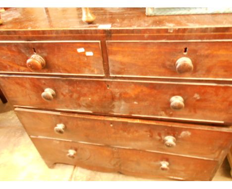 An early 19th C mahogany and boxwood strung chest of two short over three long graduated cock-beaded drawers with turned bun 