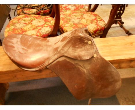 A vintage tan leather saddle