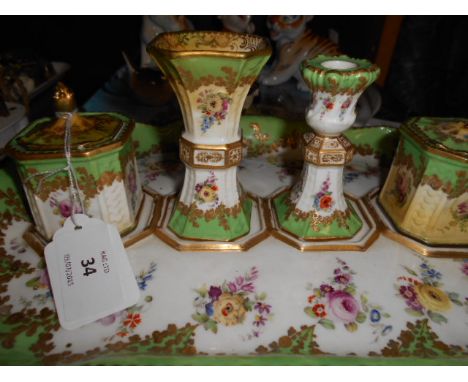 A 19th C Rockingham style hand-painted and gilt ladies dressing table set decorates with floral sprays, comprising of pot pou