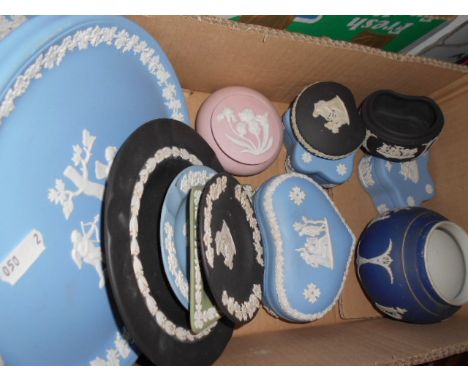 A collection of Wedgwood and Adam Jasperware to include trinket boxes, Christmas plates, ashtrays etc in blue, black and gree