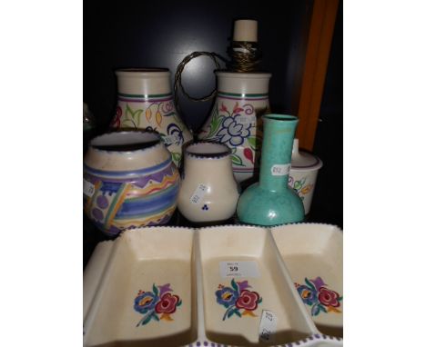 A Carter, Stabler  & Adams Poole pottery vase, a Poole pottery tale lamp, three Poole pottery vases and other Poole pottery i