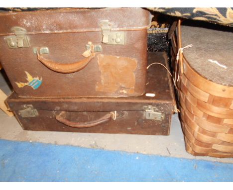 A vintage leather silk lined vanity case, a leather suit case plus a woven wooden picnic basket