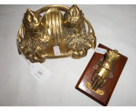 A late 19th C brass Art Nouveau double inkwell and pen tray moulded in relief with grapes and vine together with an early 20t