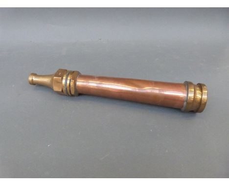 A vintage copper and brass fire hose nozzle impressed John Morris, Fire Snow Ltd, Stockport, length 44cm