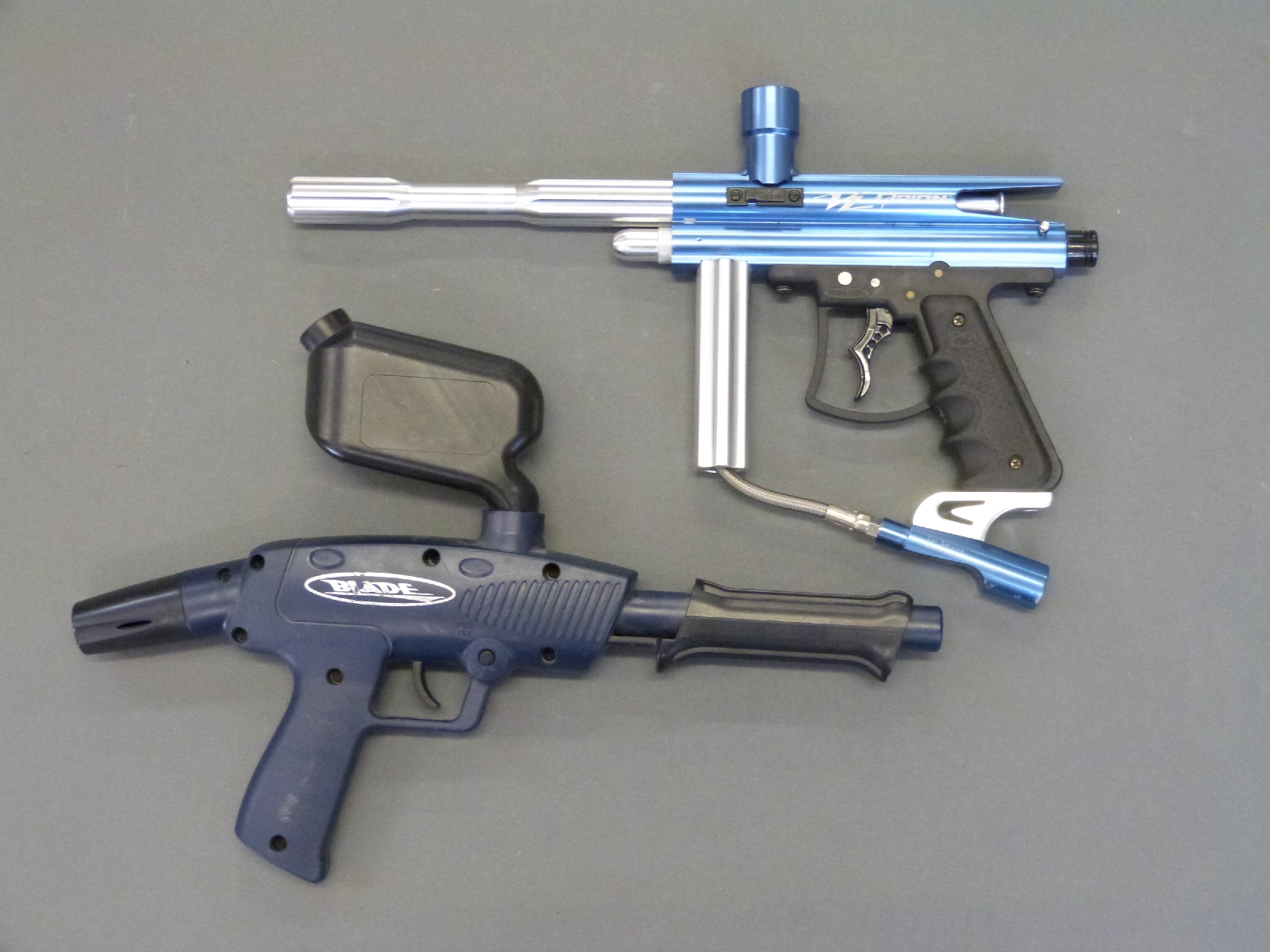 Two paintball guns, one VL Orion, the other Brass Eagle pump action