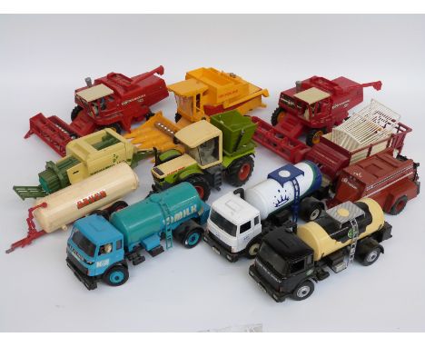 Eleven Britains 1:32 scale model agricultural vehicles including combine harvesters, milk tankers, balers etc