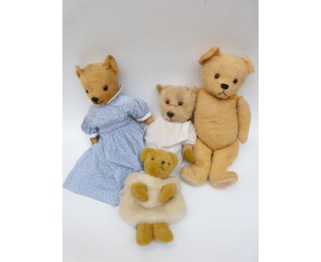 Three large blonde mohair Teddy bears together with a Merrythought bear hand muff, largest 57cm tall. 