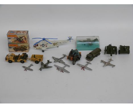 Sixteen Dinky Toys, Britains and Matchbox Lesney diecast model military vehicles including, aircraft, guns etc, some in origi