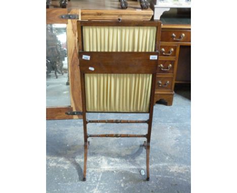 A mahogany and folded silk fire screen with rising slide action and fold down shelf H96 x W44cm 