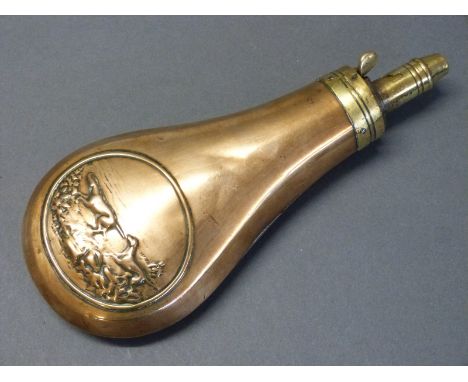 Copper and brass powder flask with embossed decoration of a man and two dogs, stamped 'patent', 20cm long. 