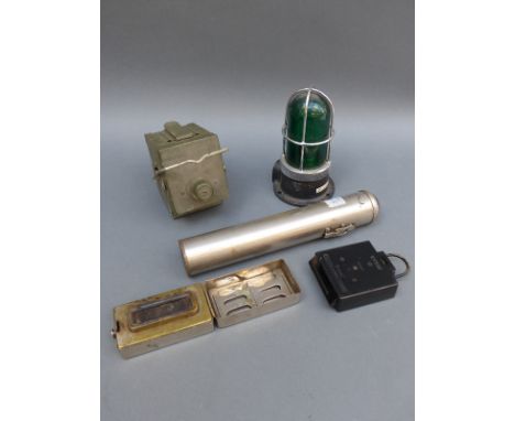A military marching compass, vintage Siemens torch, military No 2 traffic lantern and a green ship's or similar light fitting