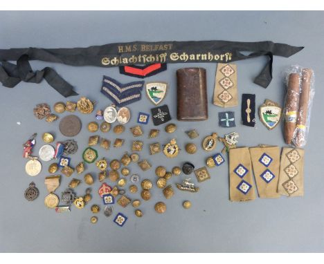 A collection of military badges, buttons etc to include bronze Woolwich and Sandhurst rugby football medal, West Riding, Warw