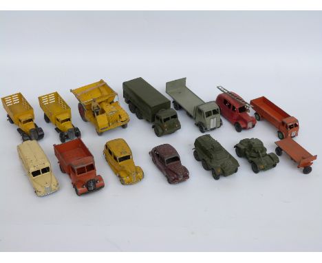 Fourteen Dinky Toys and Dinky Supertoys diecast model vehicles including military, lorries, vans, emergency vehicles etc