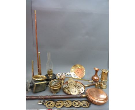 A 19thC coaching lamp, horse brasses, hunting horns, warming pan, miner's lamp etc