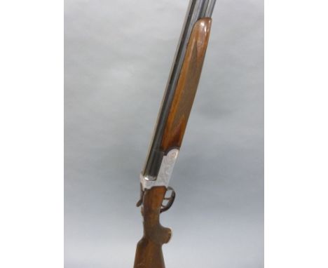 Contento 12 bore over and under shotgun with engraved locks, top plate and top lever, chequered semi-pistol grip and forend, 