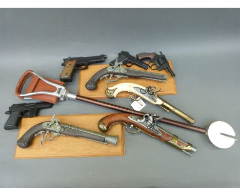 Eight replica pistols including flintlock, percussion etc, one with a faux ivory handle and two mounted on plaques, together 