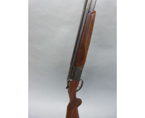 Baikal 12 bore over and under ejector shotgun with engraving to the locks, chequered semi-pistol grip, single trigger, vented