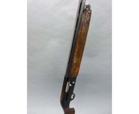 Beretta A 301 12 bore semi-automatic shotgun with engraved locks, chequered semi-pistol grip, single gilt trigger, vacant car