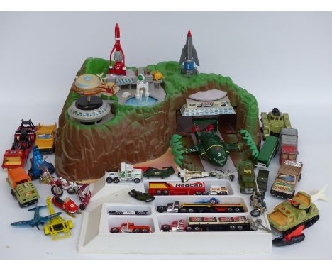 Thunderbirds Tracy Island together with related accessories and a collection of diecast model vehicles