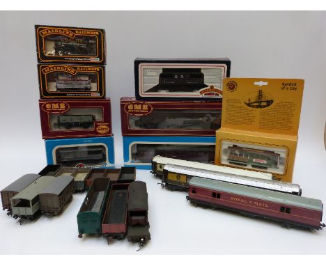 Twenty-three Hornby, Airfix, Bachmann and other 00 gauge carriages and wagons including a Bachmann Symbol of a City San Franc