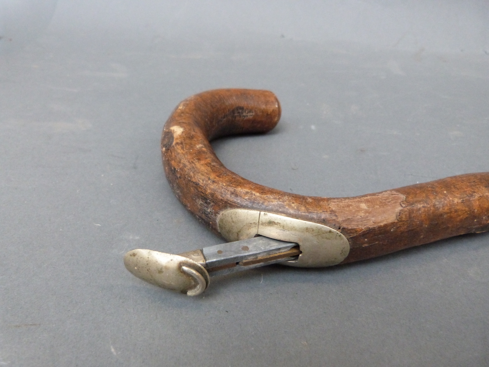 A vintage horse measuring stick with foldout brass spirit level