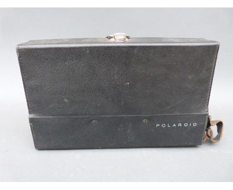 A cased Polaroid 103 camera with accessories 