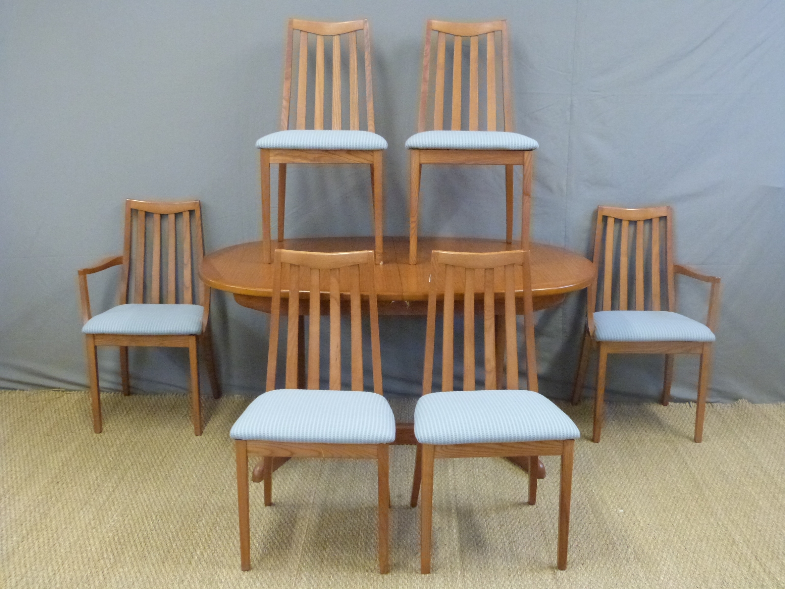 A G-Plan extending dining table and six (4+2) chairs ...