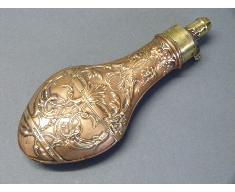 G & J W Hawksley copper and brass powder flask with embossed decoration of scrolling vines and leaves to both sides, 20.5cm l