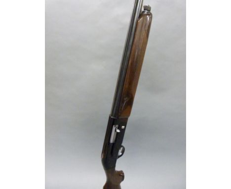 Beretta A 301 12 bore semi-automatic shotgun with ornate engraving, semi-pistol grip, vented top rib and 27 inch barrel choke