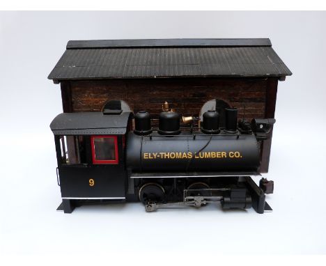 Bachmann G gauge 0-4-0 Ely-Thomas Lumber Co locomotive together with a scratch built engine shed