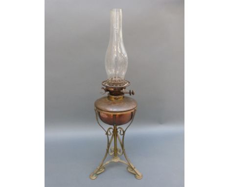 A Hinks oil lamp on ornate stand 