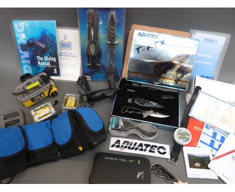 A quantity of scuba diving equipment, breathing apparatus, knives, camera, watch etc