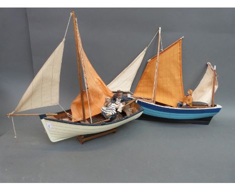 Two model clinker built sailing boats