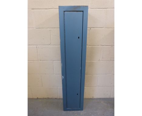 A metal gun safe / ammunition cabinet with keys