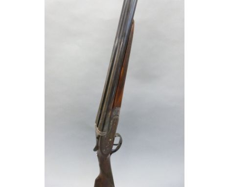 Victor Sarasquetta 20 bore side by side shotgun with named and engraved locks, engraved to top plate, top lever, underside an